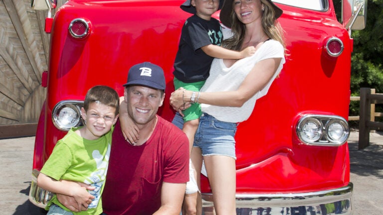 Tom Brady and Gisele Bundchen vist Cars Land with the kids