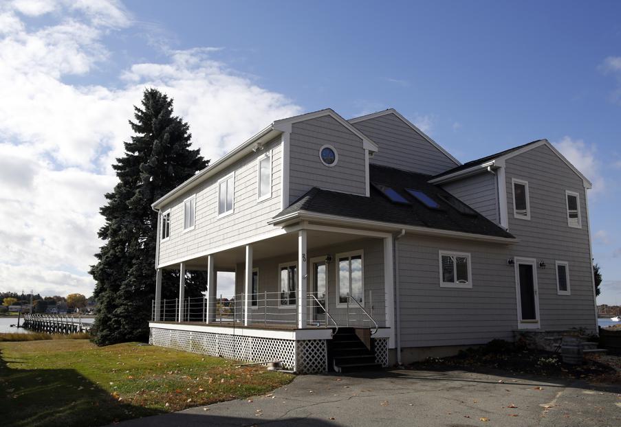 Expanded cottage with dock reaching into Danvers River is Home of the