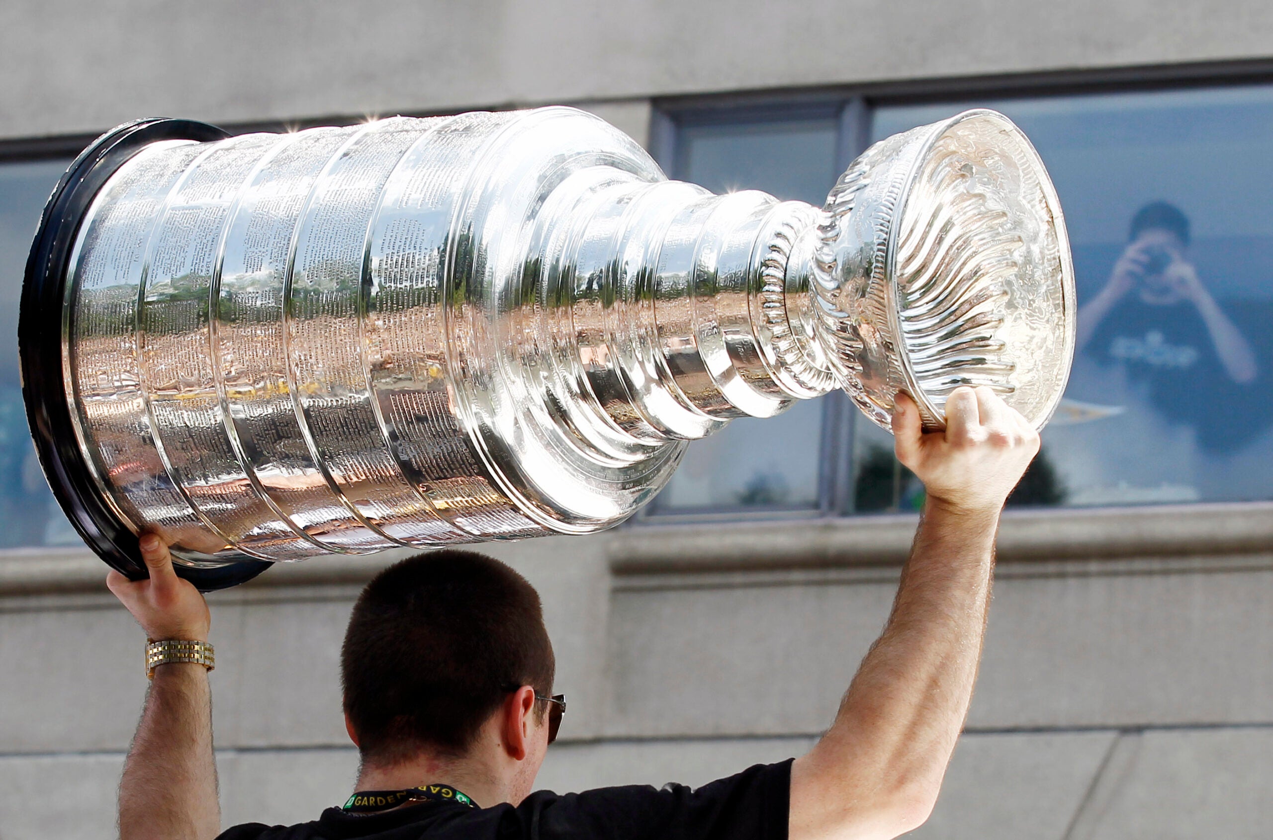 The Stanley Cup Comes to Visit, Accompanied by a Handler in White
