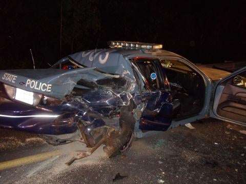 Trooper injured when car smashes into parked cruiser on I-95