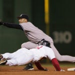 Dave Roberts dives into second base against Derek Jeter in Game 4 of the 2004 ALCS.
