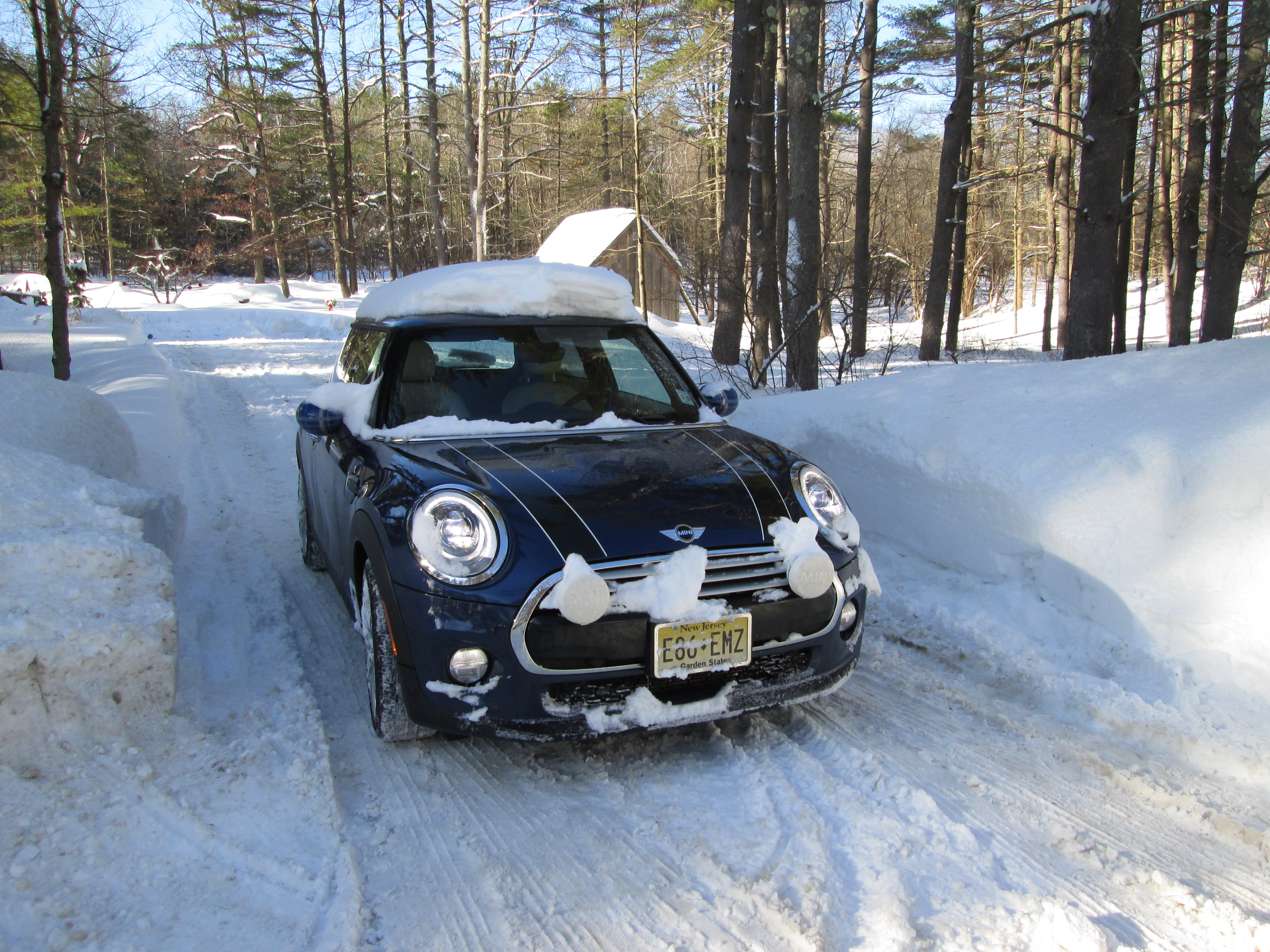 Three Small Cars Navigate A Big Winter
