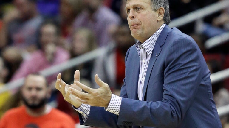 Red Auerbach shakes hands with Kevin McHale at Kevin McHale's