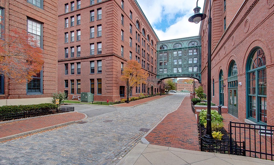 This condo in the bridge of a repurposed mill floats above Dorchester Luxury Real