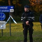 Police officers stand guard at the Brussels Airport in Zaventem following twin blasts on March 22, 2016. Around 35 people were killed and more than 200 wounded in a series of attacks in Brussels today claimed by the Islamic State group and described as a strike at the very heart of Europe. / AFP PHOTO / PATRIK STOLLARZPATRIK STOLLARZ/AFP/Getty Images