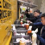 Fisku employees Max Weinstein (left) and Phil Wu are regulars at the Chicken and Rice Guys’ truck.
