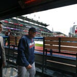 04/04/16: Cleveland, OH: With the temperature in the low 30's and the wind chill in the 20's, the heaters in the visitor's dugout are glowing red as Red Sox GM Mike Hazen (left) and manager John Farrell walk by two hours before the first pitch is scheduled to be thrown. The Boston Red Sox visited the Cleveland Indians at Progressive Field for Opening Day of the 2016 Major League baseball season. (Globe Staff Photo/Jim Davis) section:sports topic:Red Sox