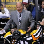 Boston Bruins coach Claude Julien argues with an official during overtime of an NHL hockey game against the Carolina Hurricanes in Boston, Tuesday, April 5, 2016. The Hurricanes defeated the Bruins 2-1 in a shootout. (AP Photo/Charles Krupa)