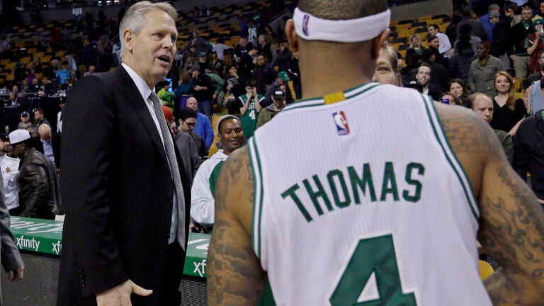 Danny Ainge holds up a Celtics jersey bearing his old number