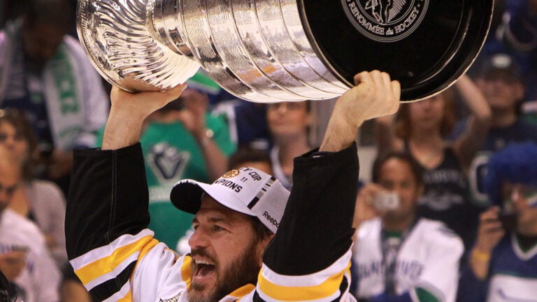 The Stanley Cup in a Pool, From L to R Mark Recchi, Rod Bri…