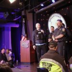 Comedian Jeff Ross sizes up Steve Horgan, better known to Red Sox fans as "Bullpen Cop," during a charity roast.