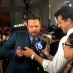 Ben Affleck watches the Red Sox during a red carpet premiere.