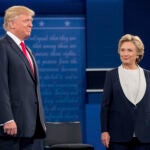 Democratic presidential candidate Hillary Clinton stands next to Republican presidential candidate Donald Trump at the second presidential debate at Washington University, Sunday, Oct. 9, 2016, in St. Louis. (AP Photo/Andrew Harnik)
