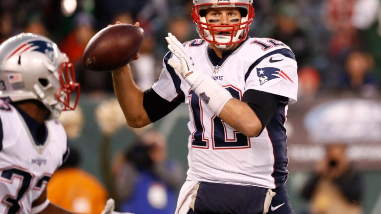 New England Patriots Tom Brady throws a pass in the first half