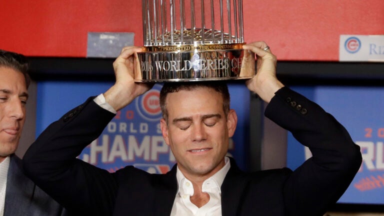 Kris Bryant holding the World Series trophy at the Chicago Cubs