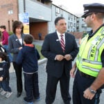 State Representative Rob Consalvo speaks with a police officer in 2013 when he was running for Boston's Mayoral Office.