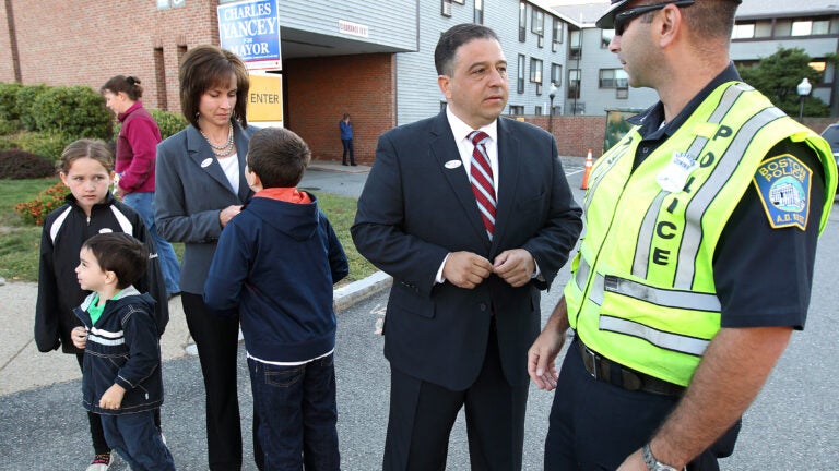 State Representative Rob Consalvo speaks with a police officer in 2013 when he was running for Boston's Mayoral Office.