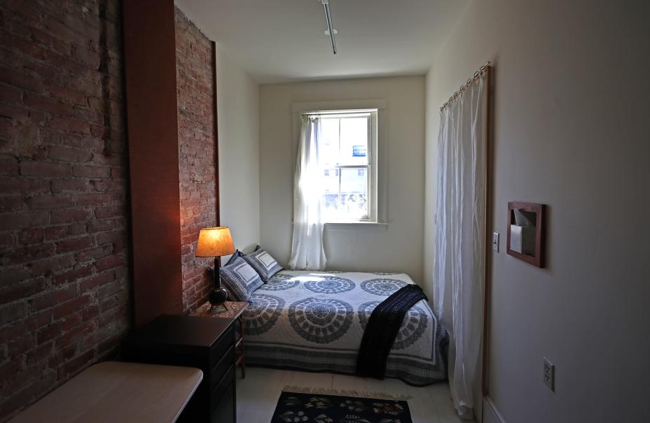 Two-bedroom condo with exposed brick overlooks Back Bay Fens