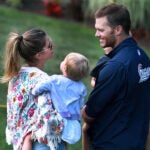 As he left the field following practice, Tom Gisele and they shared a moment together as their daughter looked on. Brady was holding his son who is behind them.