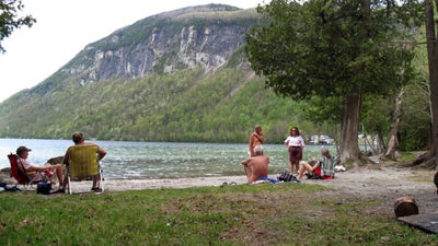 Vermont nude beach fans against parking lot, boardwalk