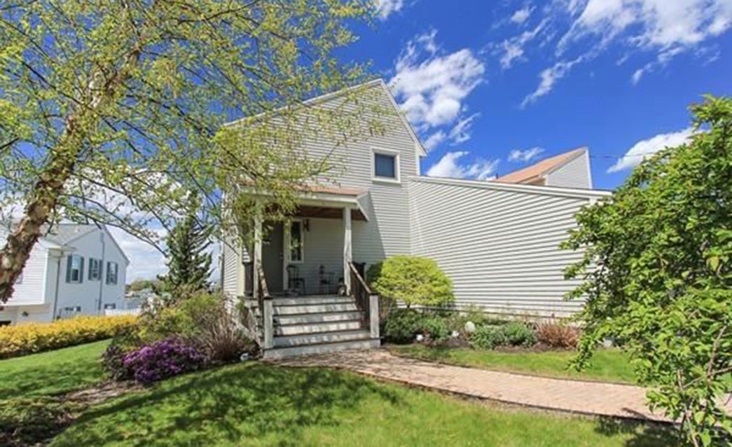 Danvers contemporary with indoor pool sits alongside Porter River