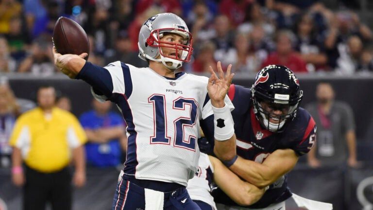 HOUSTON — Tom Brady threw a touchdown pass in his first game