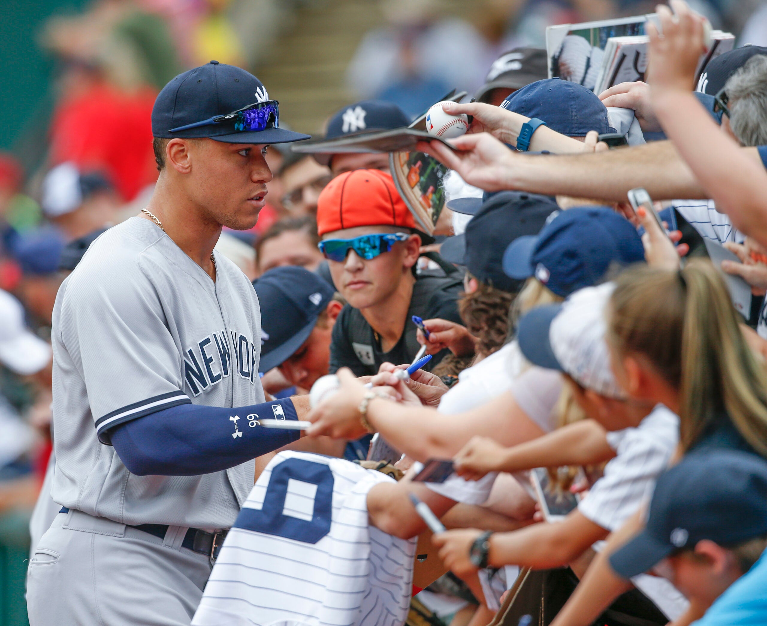 Aaron Judge signs autographs prior to the Yankees game against the
