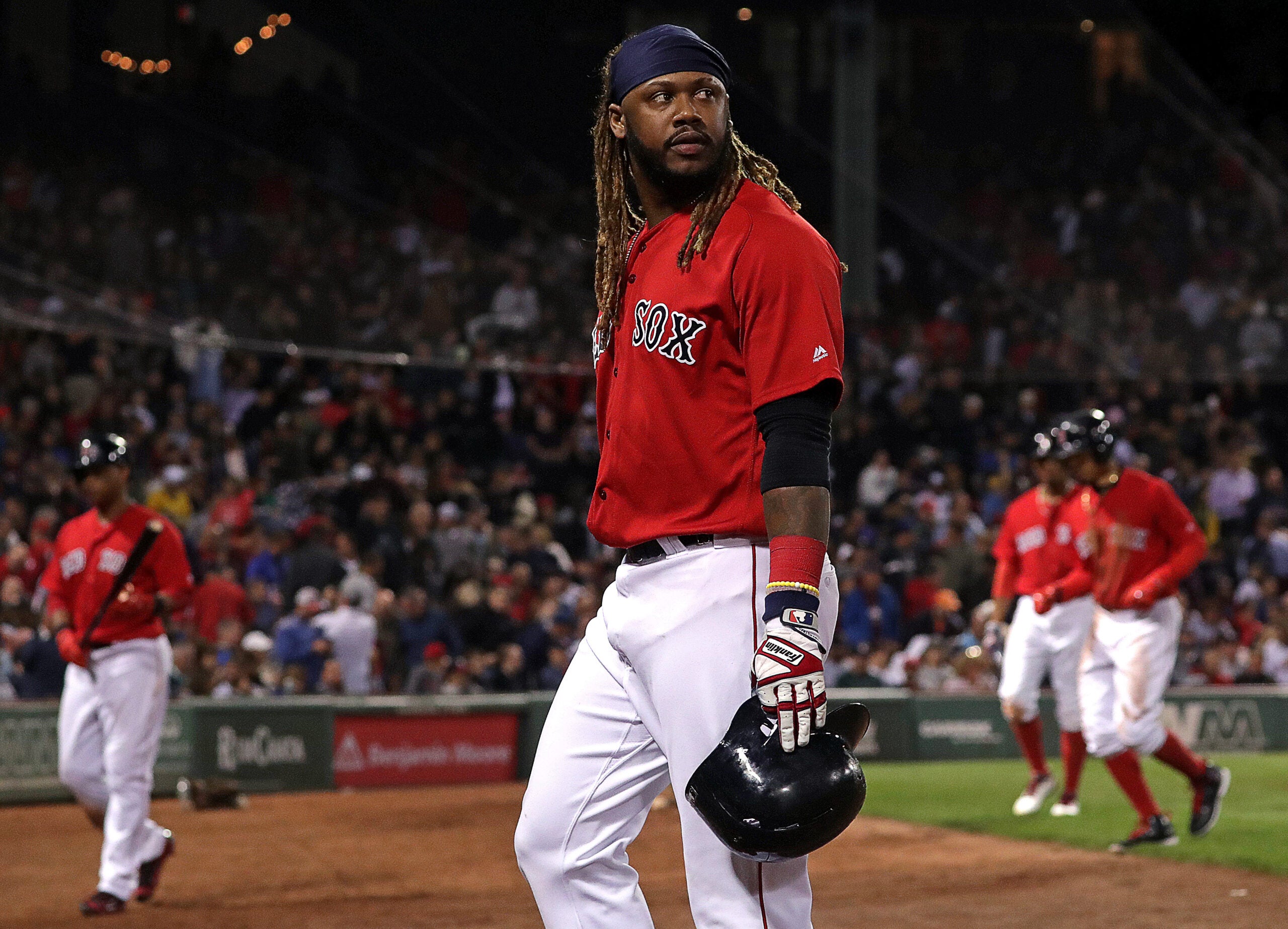 Red Sox Hanley Ramirez grimaces in pain after being stuck by a pitch