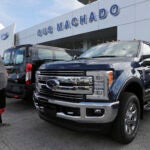 Customer looks at Ford truck in Florida