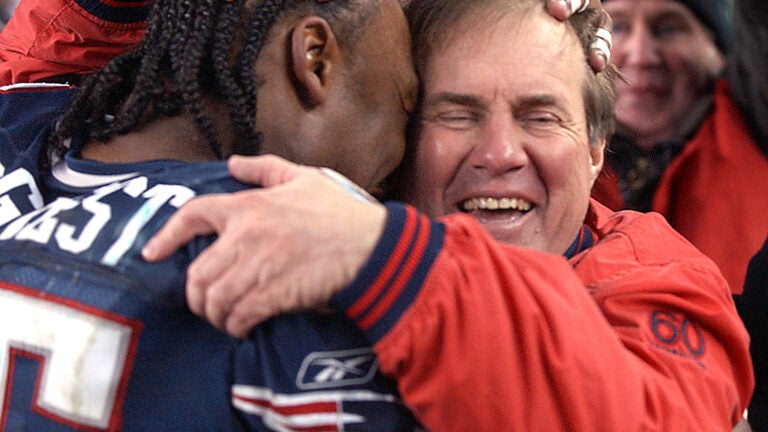 Willie McGinst, of the New England Patriots, holds up the AFC