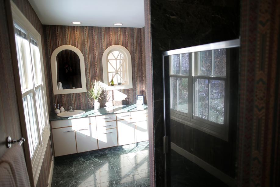 Dedham condo features reclaimed mantels, church windows