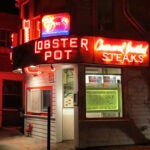 The Lobster Pot's famous neon sign on the front of the restaurant.