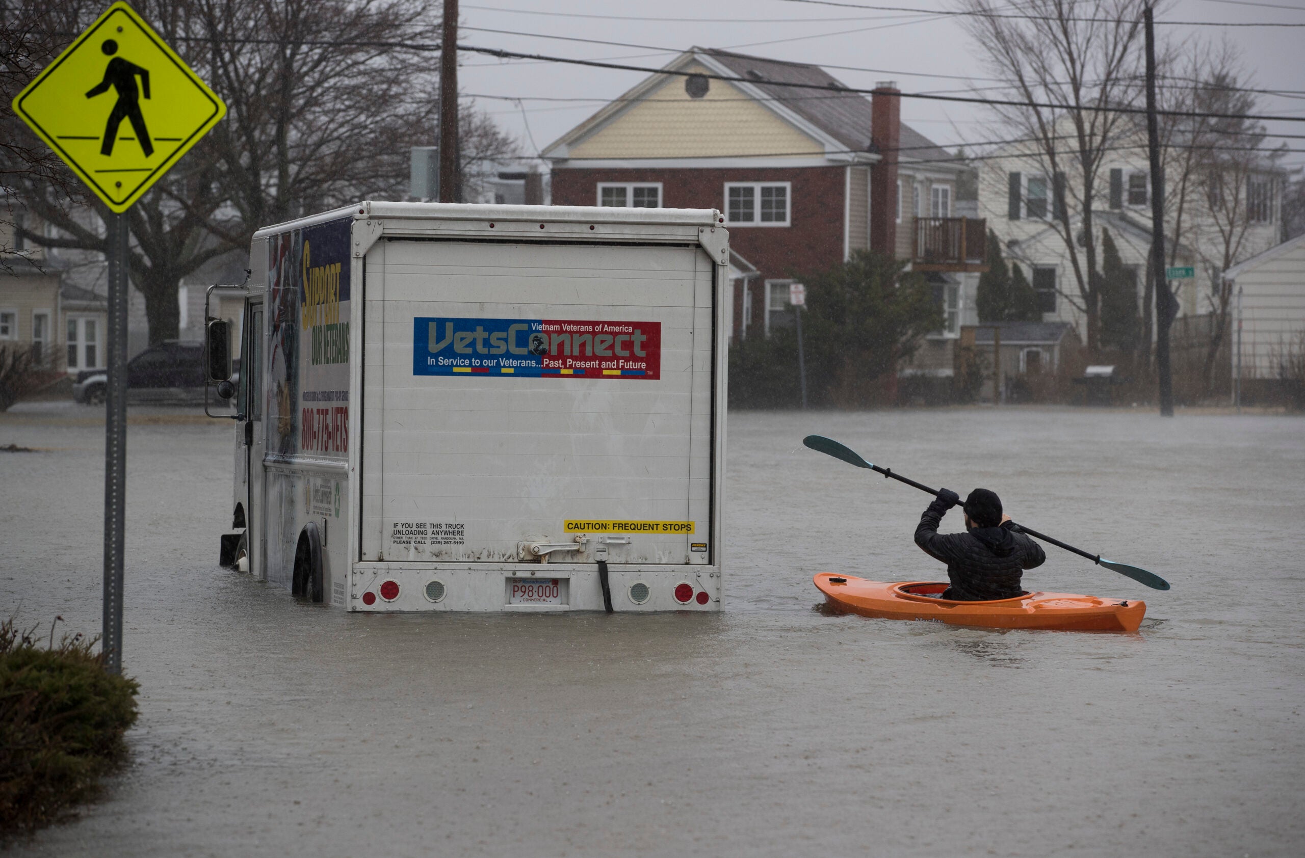 Daniel Cunningham kayaks in flood in Quincy, March 2018.