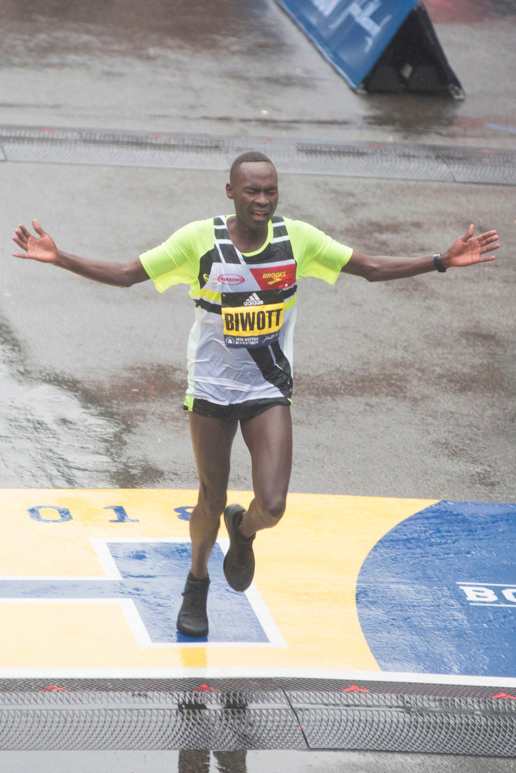 Shadrack Biwott of the United States crosses the finish line in third place for the 2018 and 122nd Boston Marathon for Elite Men's race with a time of 2:18:35 on April 16, 2018 in Boston, Massachusetts. / AFP PHOTO / RYAN MCBRIDERYAN MCBRIDE/AFP/Getty Images
