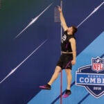 UCLA offensive lineman Kolton Miller runs a drill at the NFL football scouting combine in Indianapolis, Friday, March 2, 2018. (AP Photo/Michael Conroy)