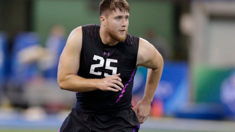 UCLA offensive lineman Kolton Miller runs a drill at the NFL football scouting combine in Indianapolis, Friday, March 2, 2018. (AP Photo/Michael Conroy)