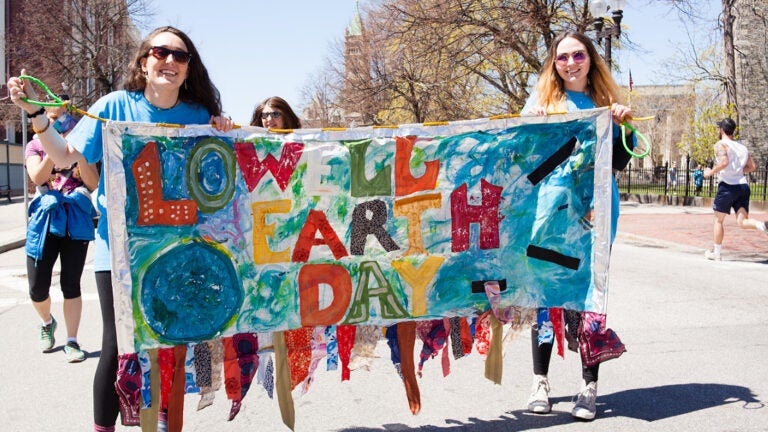 People marching in the 2017 Lowell Earth Day Parade.