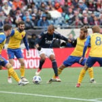 Foxborough MA 03/10/18 New England Revolution Teal Bunbury contols the ball with pressure from the Colorado Rapids defense during second half action of MLS Soccer opening day at Gillette Stadium. (Matthew J. Lee/Globe staff)