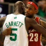 Boston Celtics forward Kevin Garnett, left, embraces Cleveland Cavaliers forward LeBron James prior to their preseason basketball game in Providence, R.I, Friday, Oct. 10, 2008. (AP Photo/Charles Krupa)