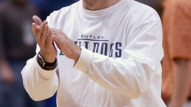 Butler coach Todd Lickliter applaudes his players during practice for the NCAA East Regional basketball tournament Thursday, March 27, 2003, in Albany, N.Y. Butler plays Oklahoma in an East regional semifinal game on Friday, March 28. (AP Photo/Kevin Rivoli) Library Tag 03282003 Sports