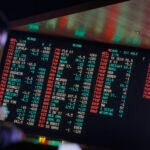 Sports gambling odds are displayed on a screen at a sports book owned and operated by CG Technology in Las Vegas.