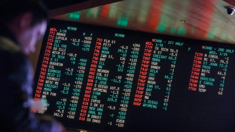 Sports gambling odds are displayed on a screen at a sports book owned and operated by CG Technology in Las Vegas.
