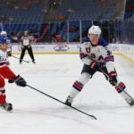Bruins prospect Trent Frederic takes the puck around Jakub Galvas of the Czech Republic during the bronze medal game of the IIHF World Junior Championship at KeyBank Center on January 5, 2018.