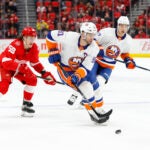 FILE - In this April 7, 2018, file photo, New York Islanders center John Tavares (91) carries the puck against the Detroit Red Wings during the first period of an NHL hockey game in Detroit. As the No. 1 pending free agent, Tavares not only gets to hand out his rose like hockey’s version of “The Bachelor” but can set the tone for the rest of the players available. He can only get an eight-year contract from the Islanders--unless they execute a sign-and-trade to recoup some value--and could very well become the league’s second-highest-paid player behind Edmonton Oilers captain Connor McDavid, who makes an average of $12.5 million a season. (AP Photo/Paul Sancya, File)