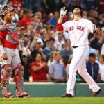 Red Sox hitter J.D. Martinez crosses home plate after hitting his 25th home run of the 2018 MLB season.
