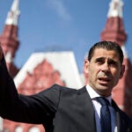 Fernando Hierro gestures as he speaks with the media at Red Square in Moscow, Russia. The Spanish soccer federation says former player Fernando Hierro will take over the national team during the World Cup.