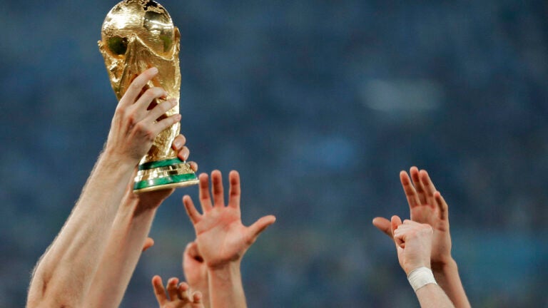 Germany players holding the World Cup trophy aloft in 2014.