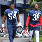 Christian Sam and Jason McCourty at Patriots training camp.