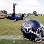 Tennessee Titans defensive back Malcolm Butler stretches during training camp, 2018.