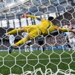 France's goalkeeper Hugo Lloris dives to make a save during the 2018 World Cup quarterfinals against Uruguay.